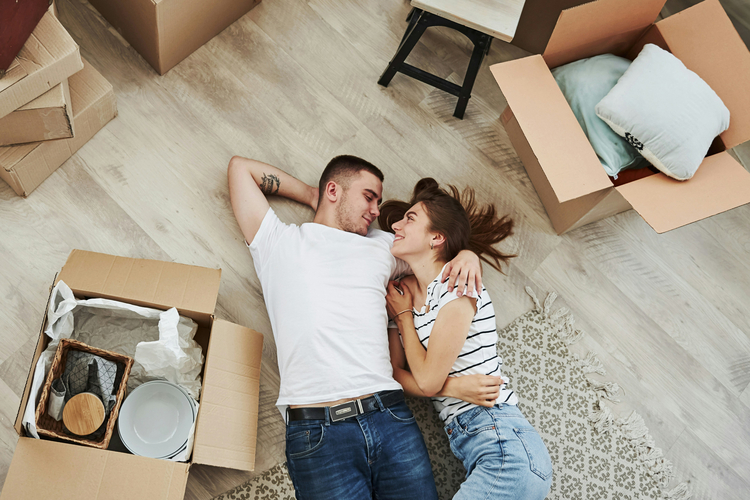 Young couple on new living room floor.