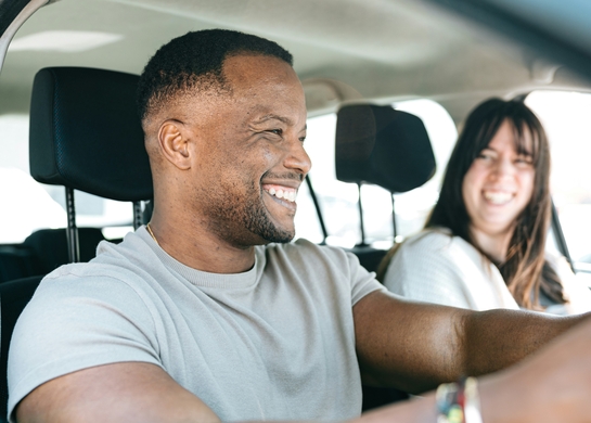 Happy couple in a car