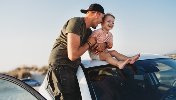 Dad drives his son to the beach