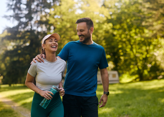 A couple exercising in the park.