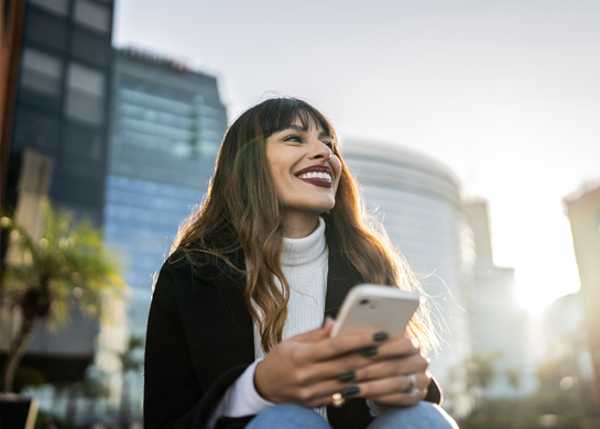 woman laughing outdoors
