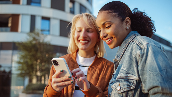two friends looking at phone