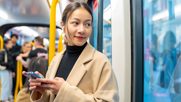 woman on bus holding phone