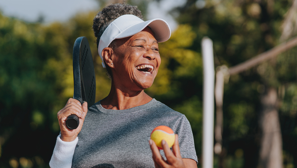 Woman plays pickleball