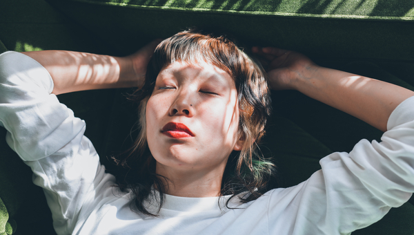 Woman relaxes on her couch