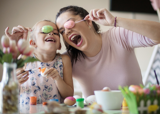 Mum and daughter paint eggs