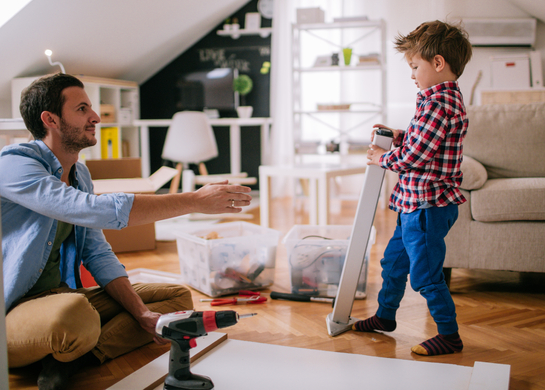 Son helps dad build furniture