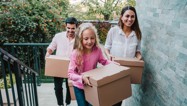 Family walks upstairs into new home