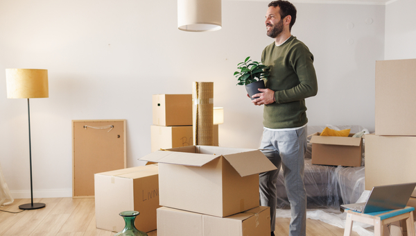 Man stands around boxes