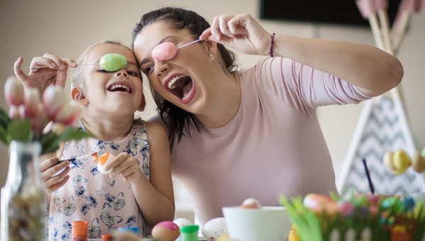 Mum and daughter paint eggs