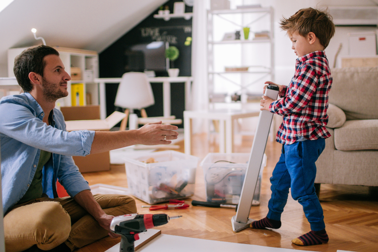 Son helps dad build furniture