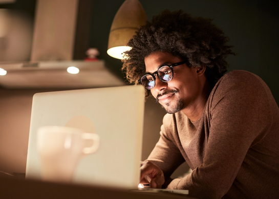 Man works on his laptop