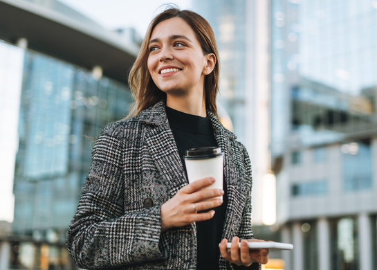 Office worker holds a coffee