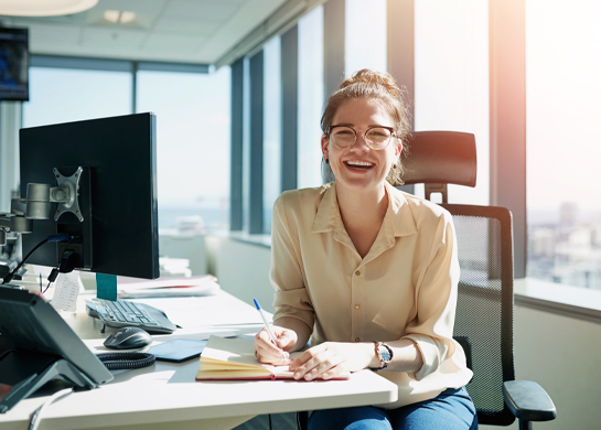 smiling woman at desk