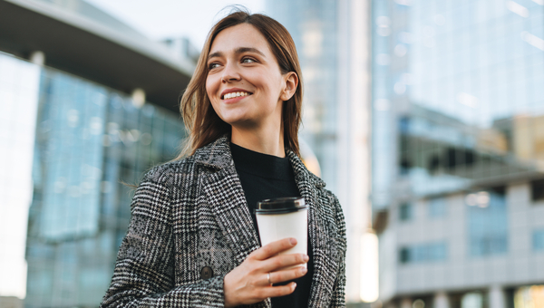 Office worker holds a coffee