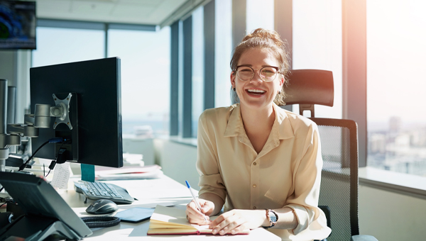 smiling woman at desk