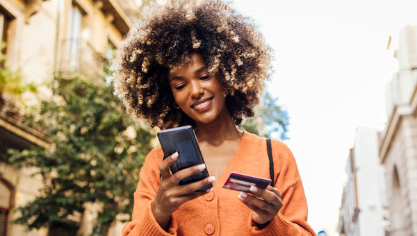 Woman outside using online payment