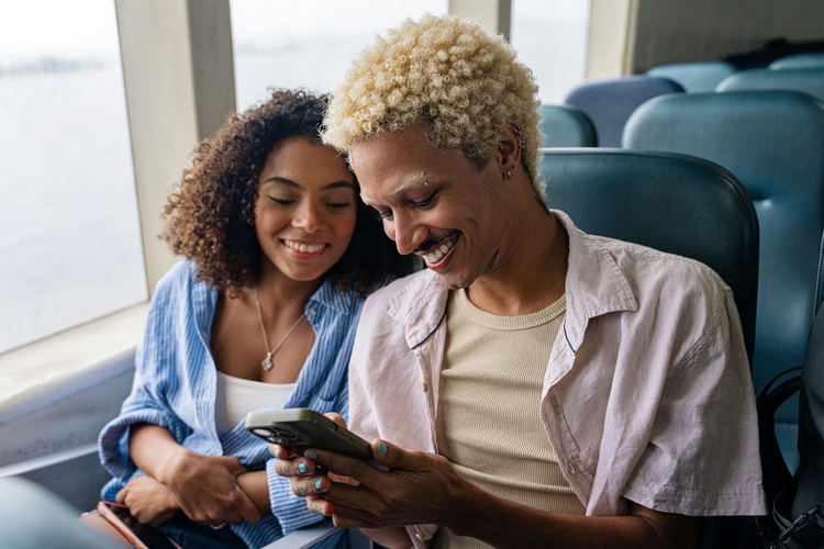 Couple smiles on the train