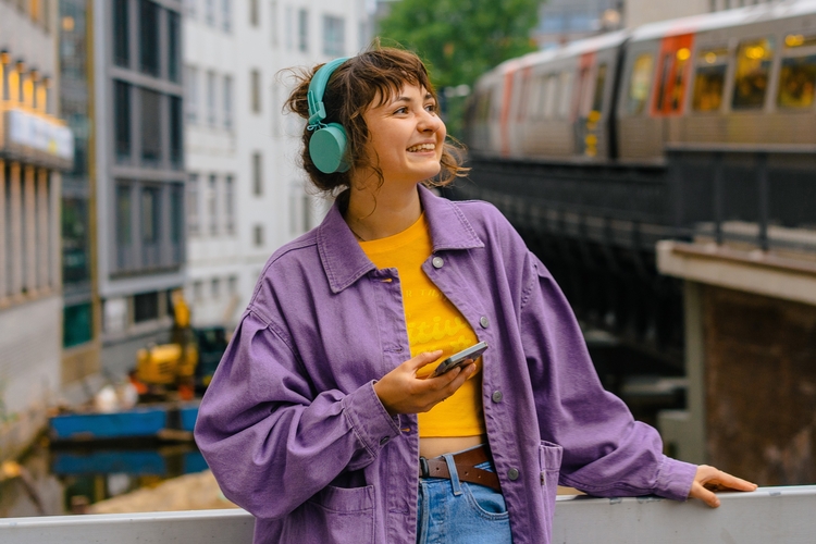 Girl listening to music outside