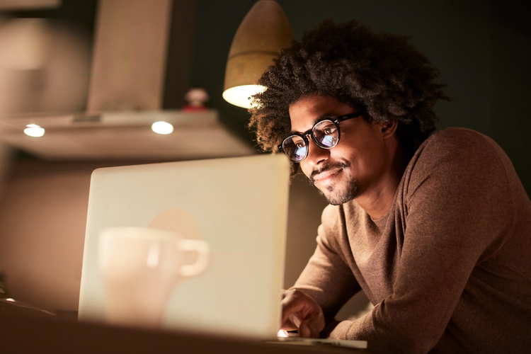 Man works on his laptop